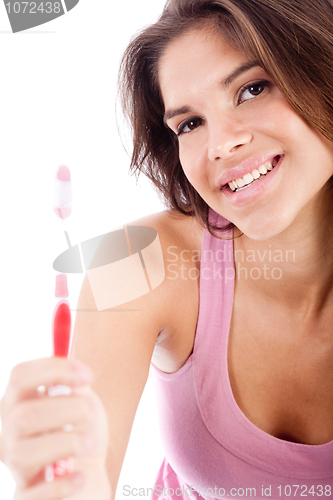 Image of happy young women showing her toothbrush
