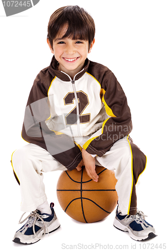 Image of Kid stylishly sitting on the ball