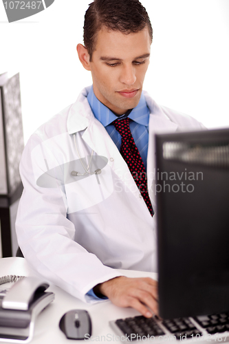 Image of young physician working on his office