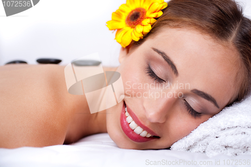 Image of Beautiful young woman relaxing and smiling