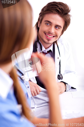 Image of Smiling male doctor looking the side cornor