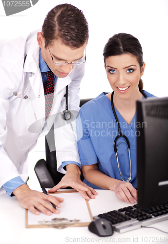 Image of Young doctors team discussing and making notes