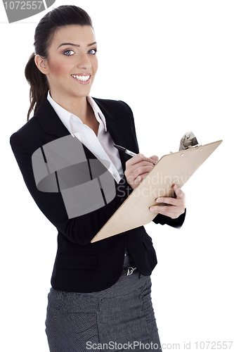 Image of Business professional writes on pad