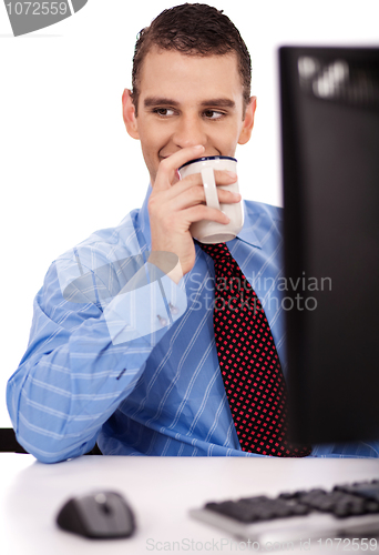 Image of Business man have a drink on his office