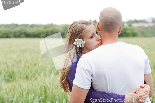 Image of Loving couple standing in the field