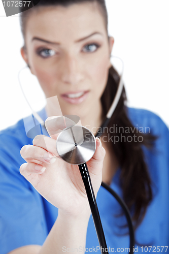 Image of Closeup shot of female nurse with Stethoscope, focus on Stethoscope