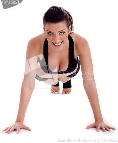 Image of Fitness lady performs pushups on the floor
