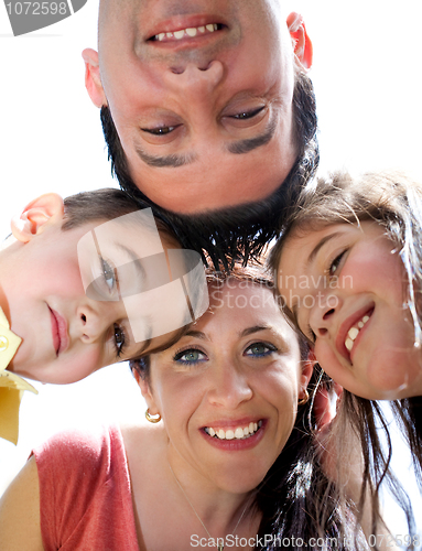 Image of Closeup portrait of a happy family in circle