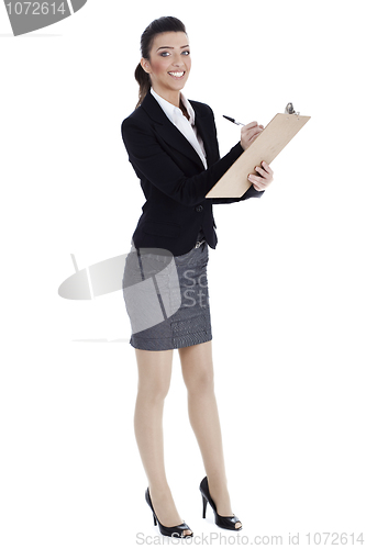 Image of Full length of business woman writing in pad