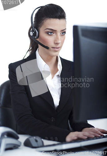 Image of Beautiful business woman with headset