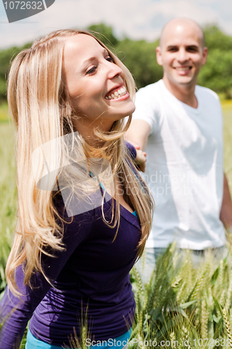 Image of Young couple enjoying themselves