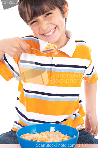 Image of Young boy eating his breakfast