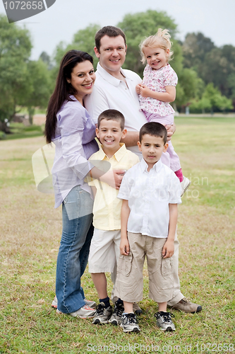 Image of Happy family of five posing on natural background