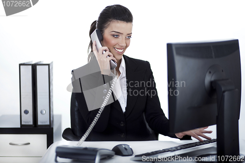 Image of Business woman busy at office