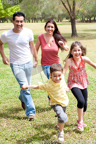 Image of Family playing in the green field