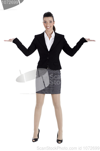 Image of Beautiful business woman streching both the hands and pointing empty space