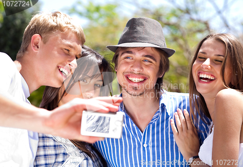 Image of group of happy smiling couples taking picture together