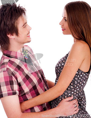 Image of Portrait of smiling young romantic couple holding and looking each other