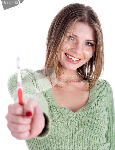 Image of Beautiful woman holding tooth brush