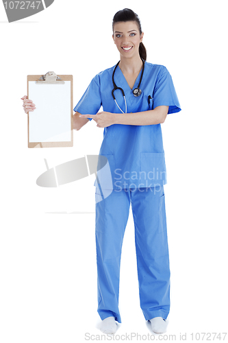 Image of Full length of young nurse pointing blank clipboard