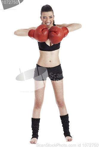 Image of Female boxer looking very focused with red gloves