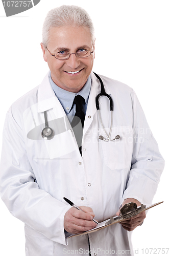 Image of Portrait of senior doctor writing reports