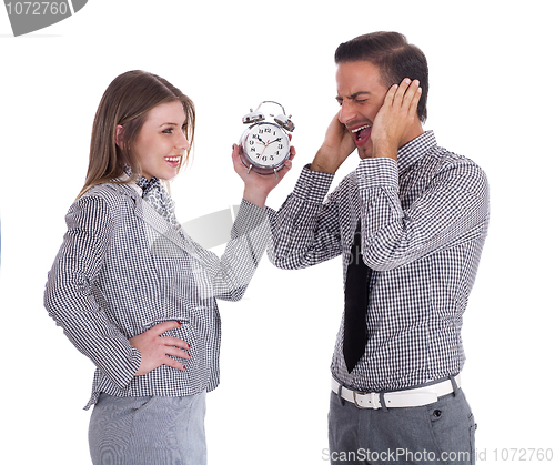 Image of Young Business men and women having fun with alarm clock
