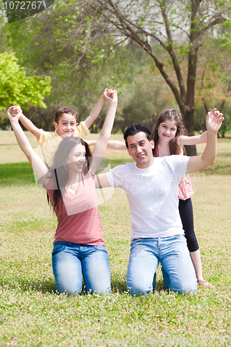 Image of Full length of Happy family enjoying their holidays