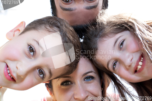 Image of Closeup portrait of a happy family in circle