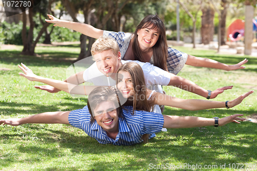 Image of laughing young friends having fun