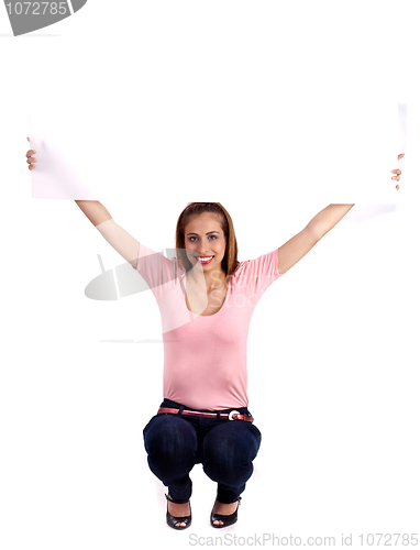 Image of Smiling pretty woman with casual wear sitting and showing the white blank board