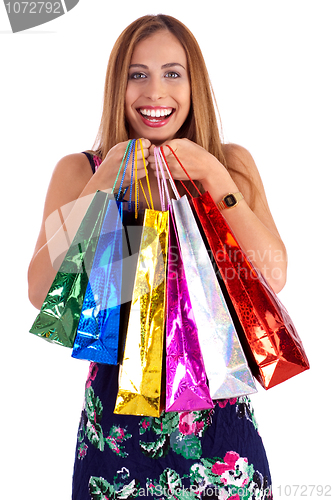Image of Happy woman holding lots of shopping bags in her hand