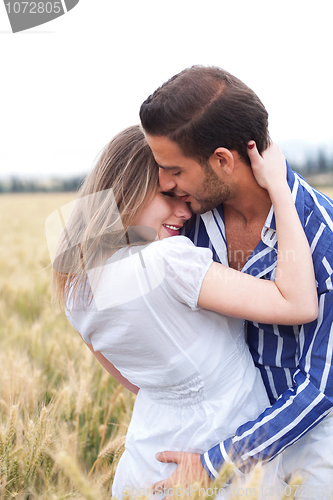 Image of Portrait of a young Couple hugging and kissing