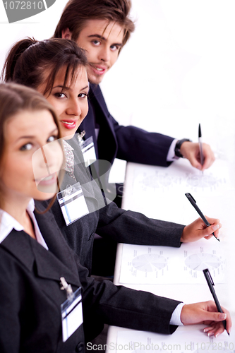 Image of Closeup of attractive business woman with colleague