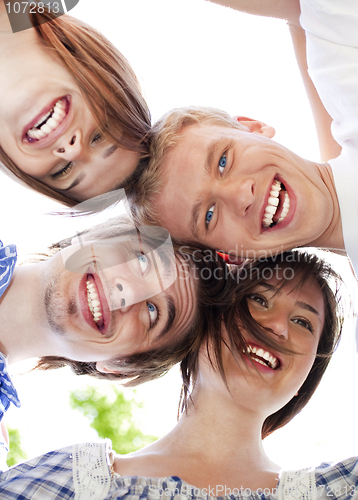 Image of Circle of happy friends with their heads together