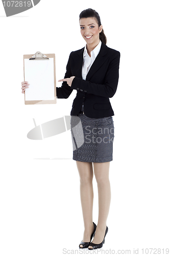 Image of Full length of business woman pointing at the clipboard