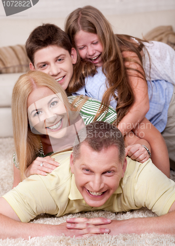 Image of Portrait of happy family Lying On Top Of Each Other