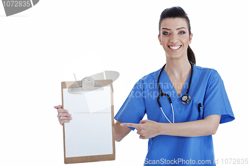 Image of Portrait of young nurse pointing blank clipboard