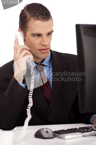 Image of young profesional business men sitting and talking over phone