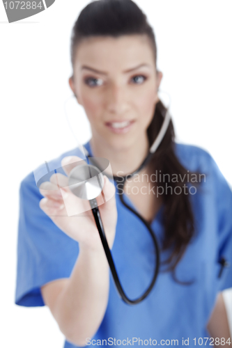 Image of Blurred image of the nurse holding stethoscope