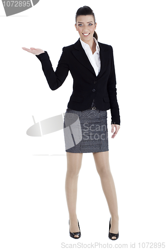 Image of Full length of young woman pointing copysapce