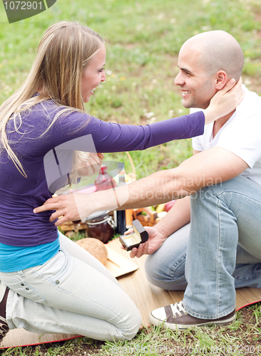 Image of Man presenting a gift to her girlfriend