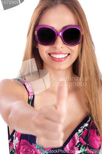 Image of Young woman showing her thumbs up