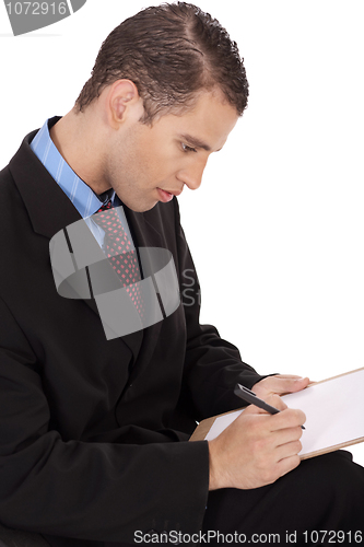 Image of Closeup of a business man writing down
