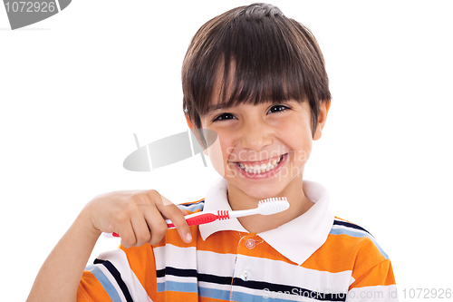 Image of Closeup of cute kid brushing his teeth
