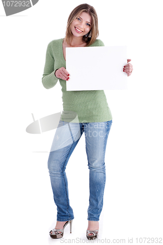 Image of Smiling young beautiful woman holding blank white board