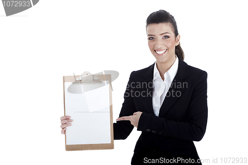 Image of Smiling young business lady pointing the plain paper