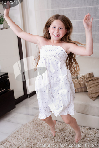 Image of Young little girl jumping