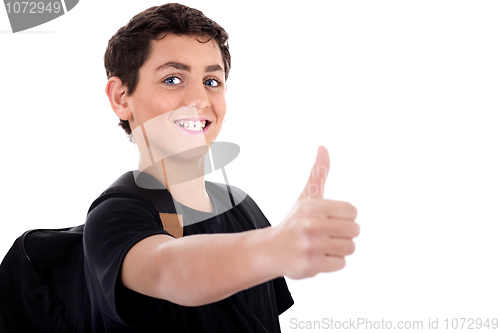 Image of Side pose of teenager shows thumbs up