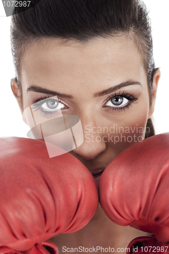 Image of young attractive woman wearing red gloves